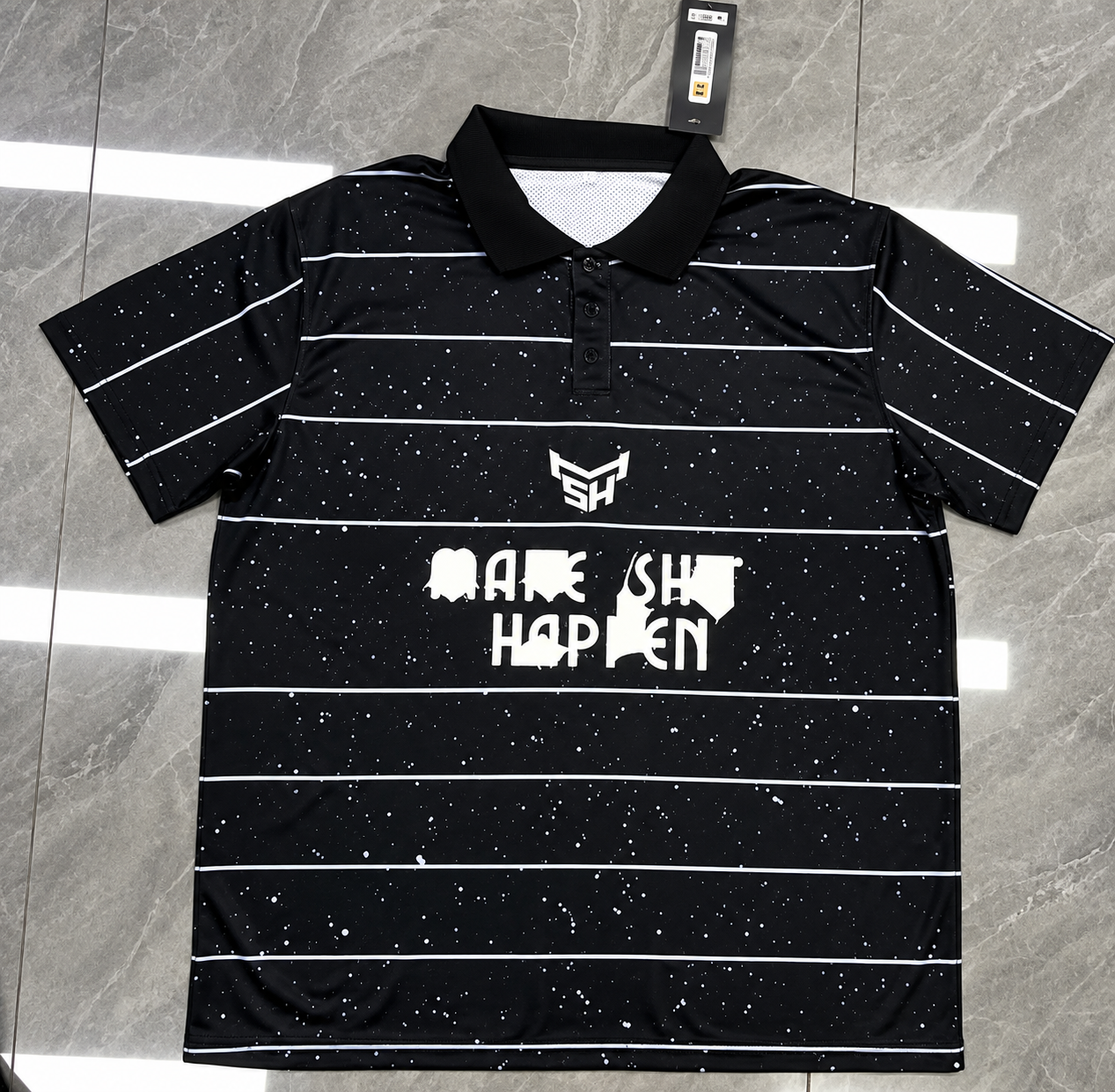 Finished black and white speckled stripe polo kit with retail tag attached