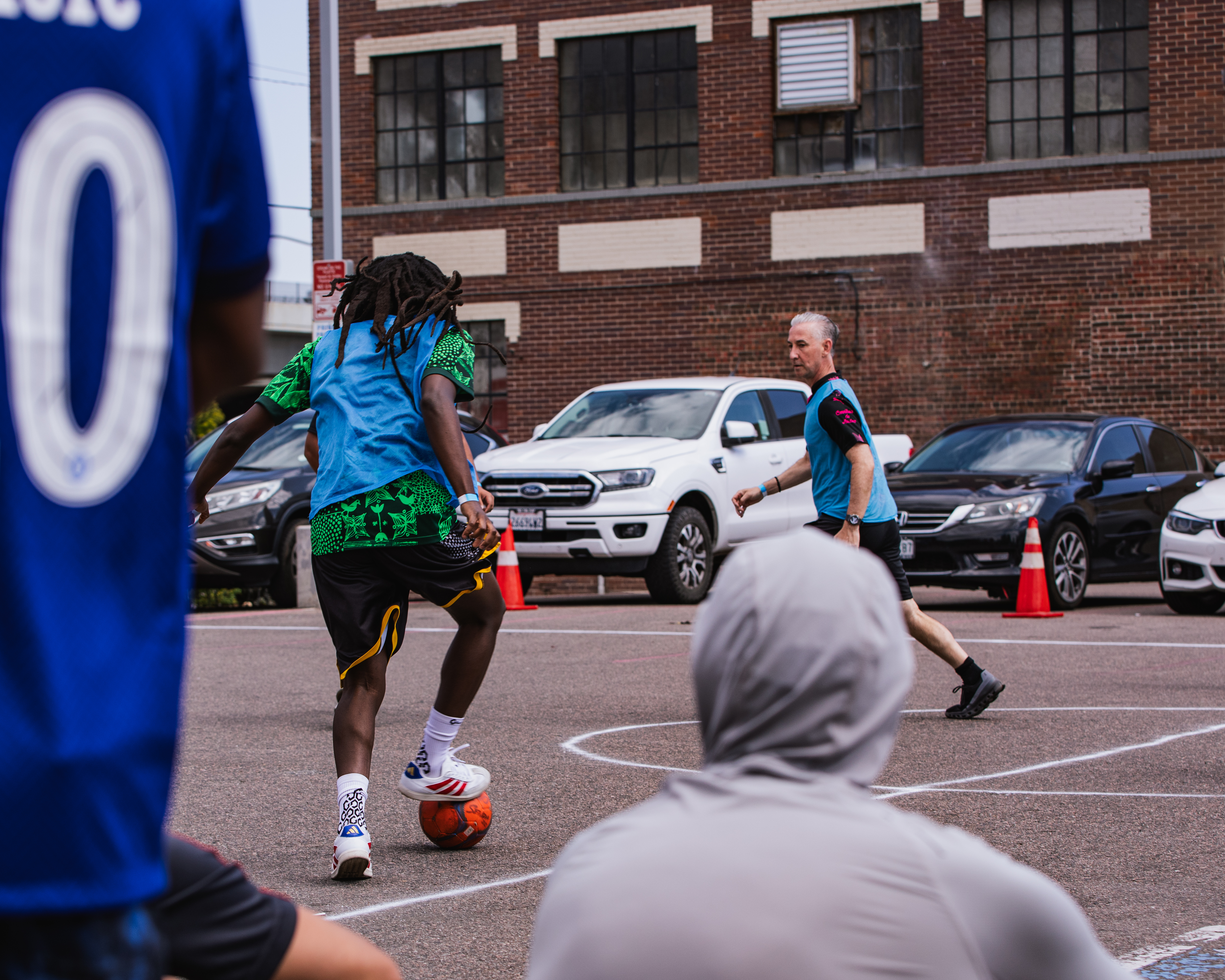 Street soccer in a parking lot