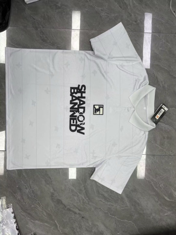 Finished all-white custom polo jersey laid out flat